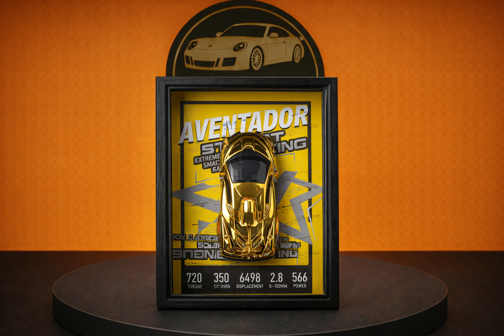 Golden Lamborghini Aventador model displayed in black frame with yellow background on round black table