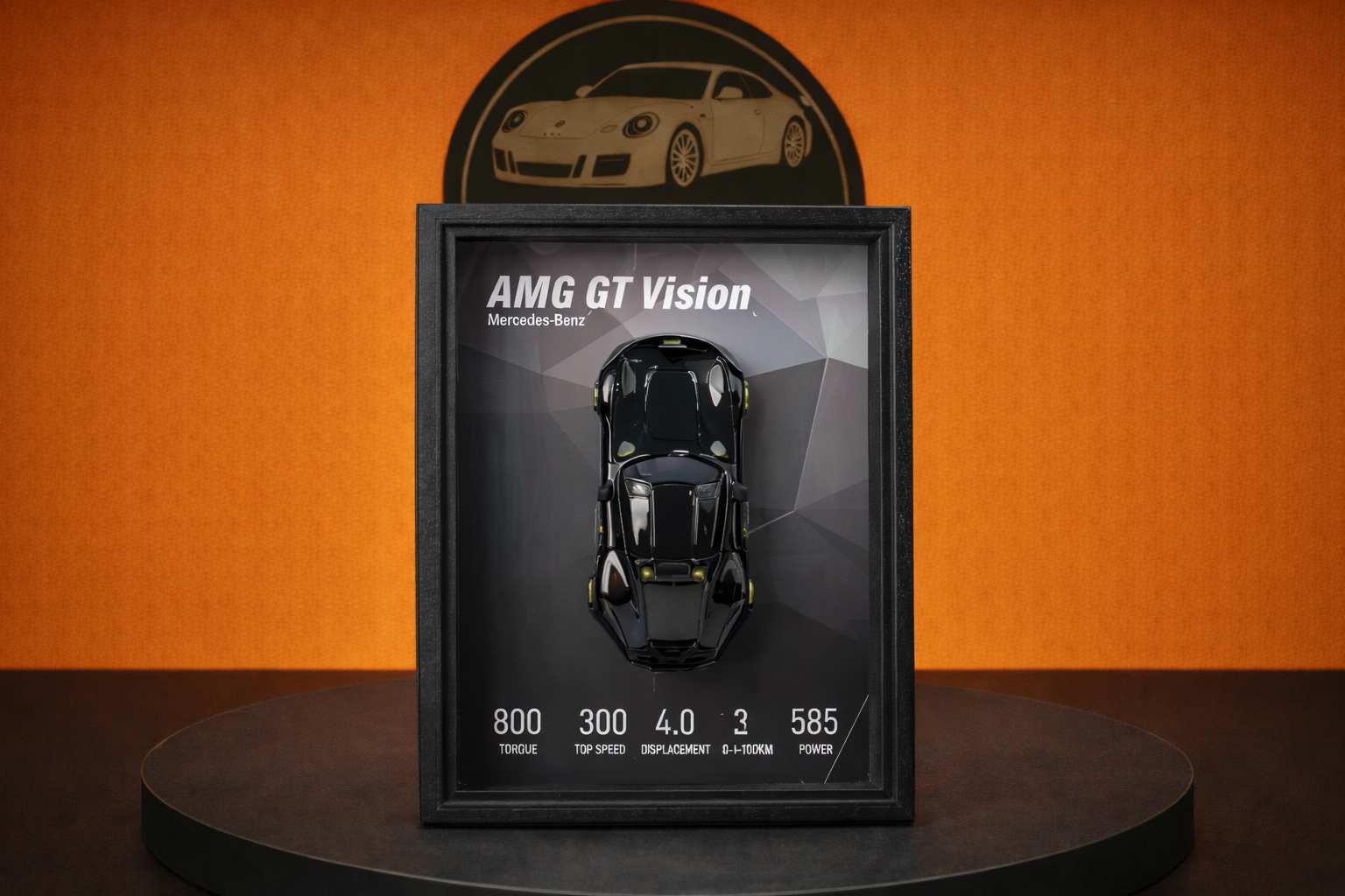 Mercedes-Benz AMG GT Vision scale model in black framed display with specs on orange background